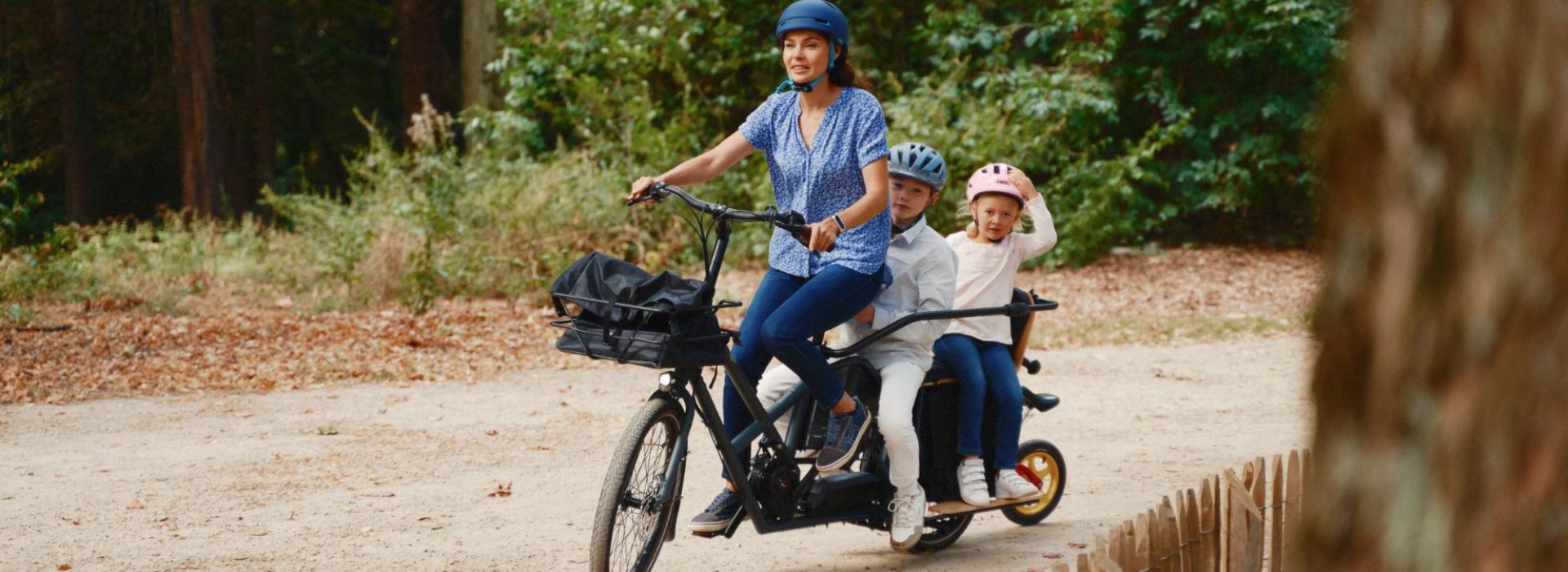 Family aboard longtail cargo bike